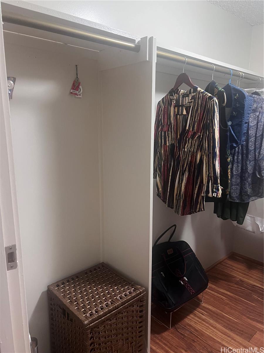 1650 Ala Moana Boulevard, Unit 3107 Honolulu, HI 96815 - Photo 5 of 22 a view of walk in closet with clothes and shoes