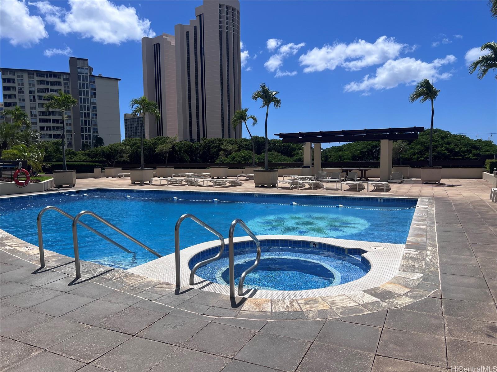 1650 Ala Moana Boulevard, Unit 3107 Honolulu, HI 96815 - Photo 9 of 22 a view of a chairs and table in a patio