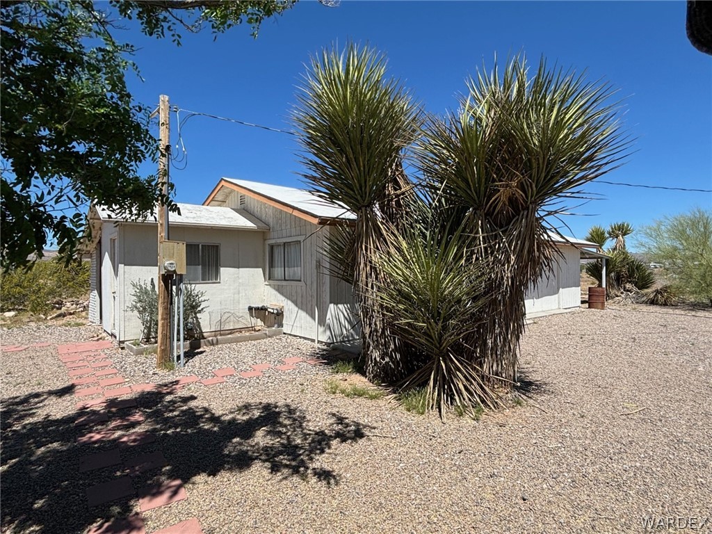 3565 Ehrenberg Road Golden Valley, AZ 86413 - Photo 20 of 63 a view of a house with a yard