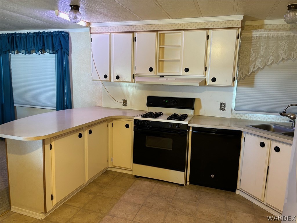 3565 Ehrenberg Road Golden Valley, AZ 86413 - Photo 25 of 63 a kitchen with stainless steel appliances a stove a sink and a refrigerator