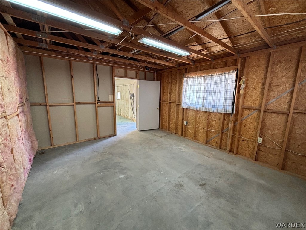 3565 Ehrenberg Road Golden Valley, AZ 86413 - Photo 42 of 63 a view of an empty room with wooden walls