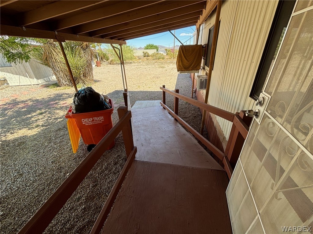 3565 Ehrenberg Road Golden Valley, AZ 86413 - Photo 49 of 63 a view of a balcony with chairs