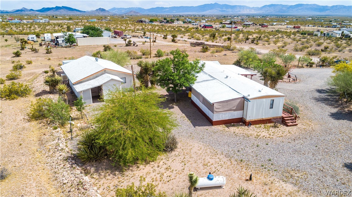 3565 Ehrenberg Road Golden Valley, AZ 86413 - Photo 5 of 63 an aerial view of a house with a mountain