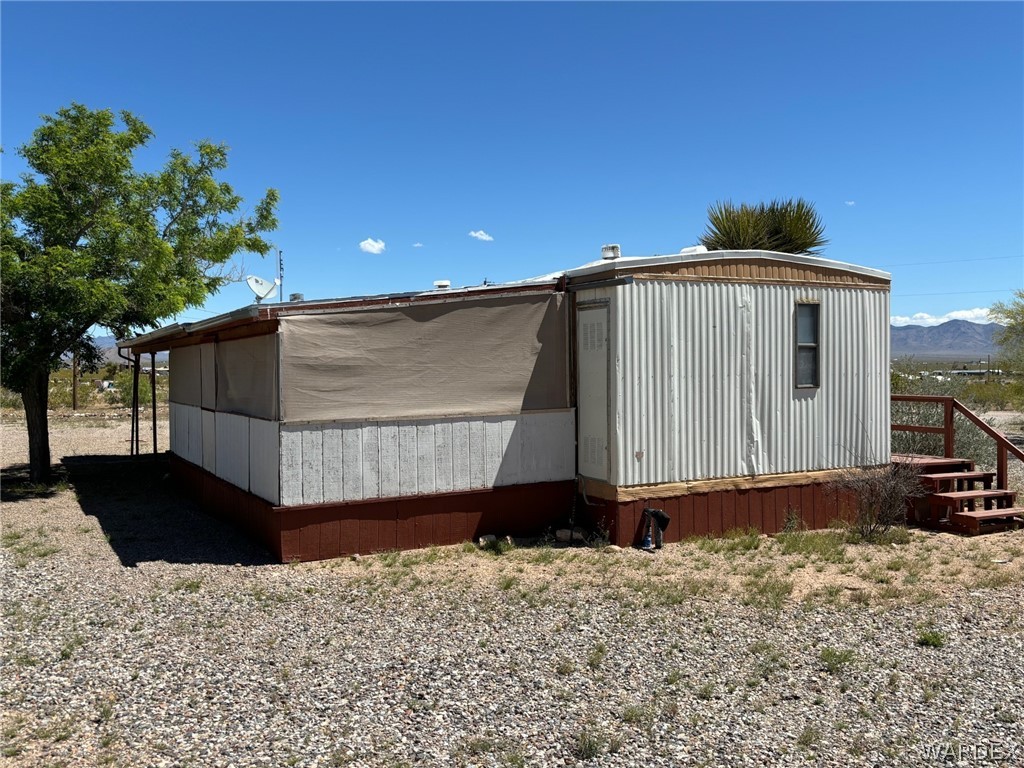 3565 Ehrenberg Road Golden Valley, AZ 86413 - Photo 53 of 63 a front view of a house with a yard