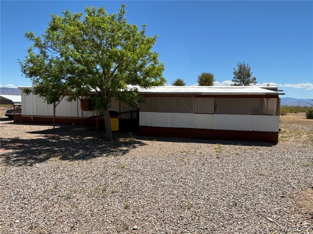 3565 Ehrenberg Road Golden Valley, AZ 86413 - Photo 54 of 63 a view of a backyard of the house