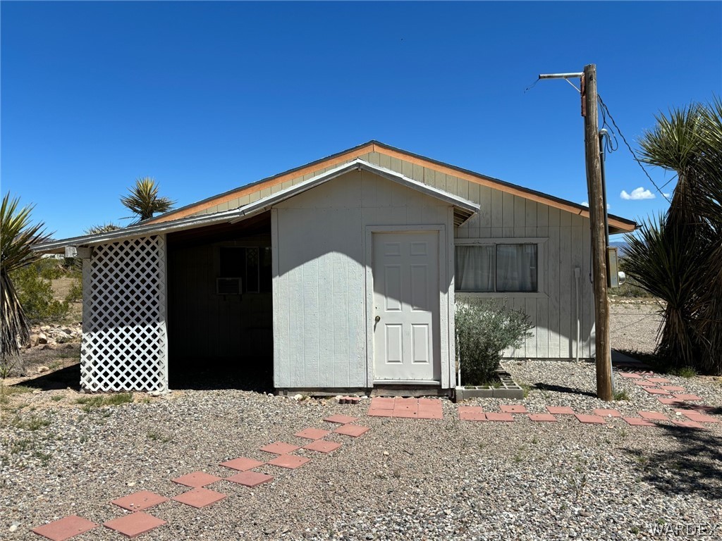 3565 Ehrenberg Road Golden Valley, AZ 86413 - Photo 55 of 63 a front view of a house with a garage