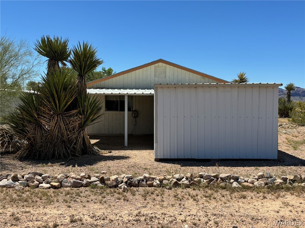 3565 Ehrenberg Road Golden Valley, AZ 86413 - Photo 57 of 63 a view of a house with a yard