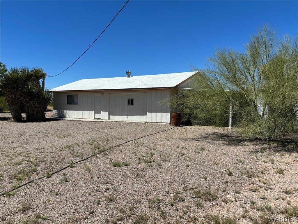 3565 Ehrenberg Road Golden Valley, AZ 86413 - Photo 59 of 63 a view of a house with a backyard
