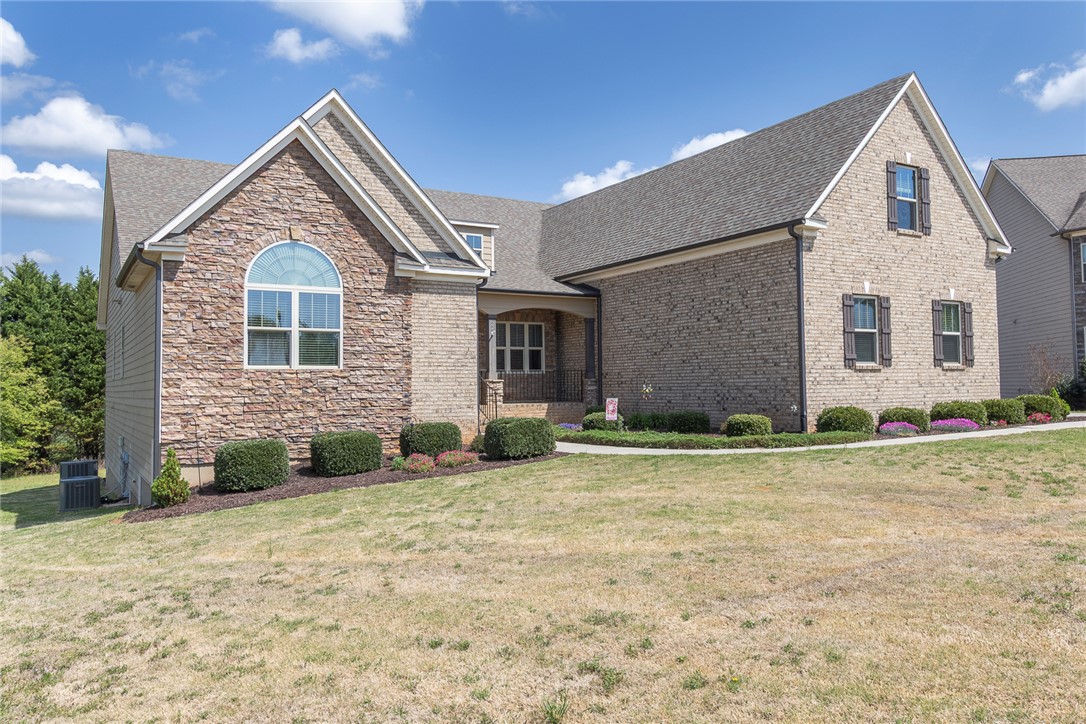 22 Old American Boulevard Pendleton, SC 29670 - Photo 46 of 49 This charming home features a mix of brick and stone with mature landscaping.