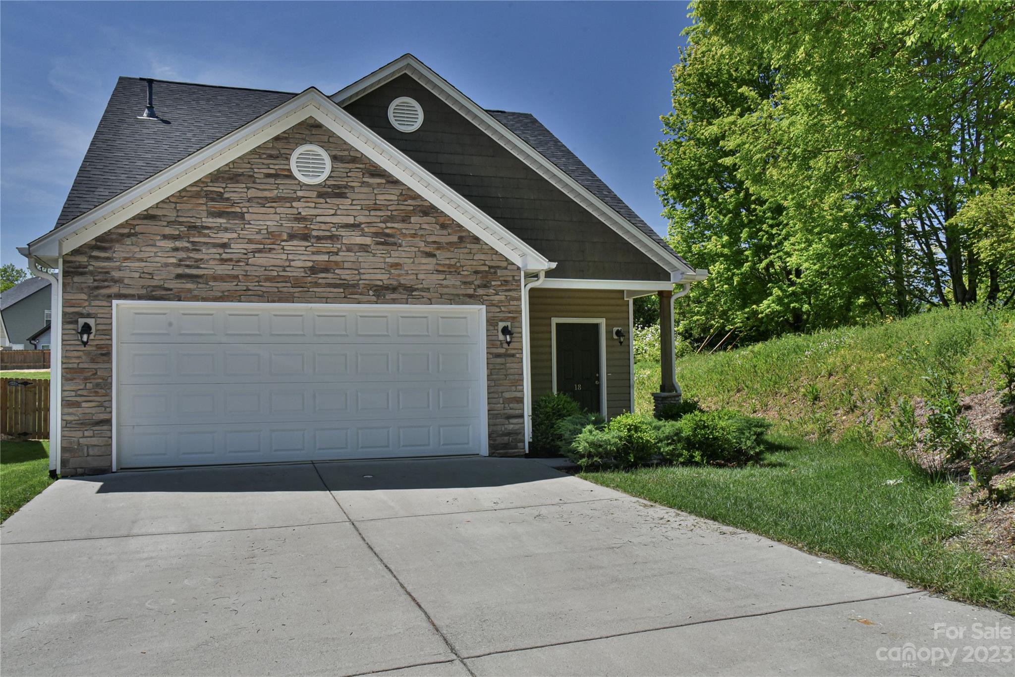 18 Yadkin Road Fletcher, NC 28732 - Photo 1 of 25 a front view of a house with garden