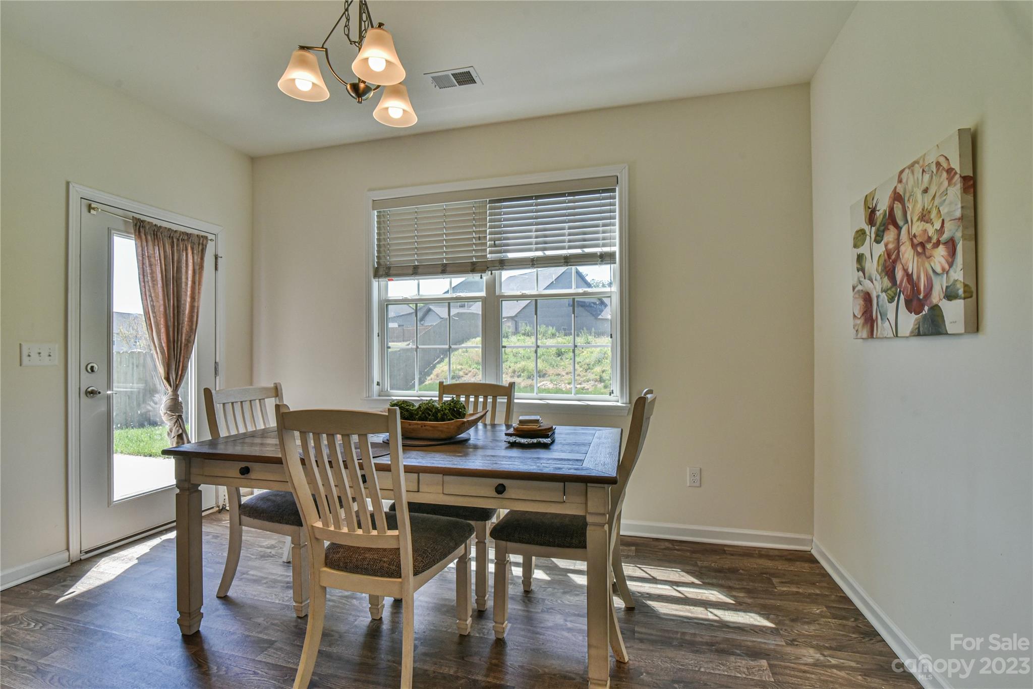 18 Yadkin Road Fletcher, NC 28732 - Photo 12 of 25 a view of a dining room with furniture window and wooden floor