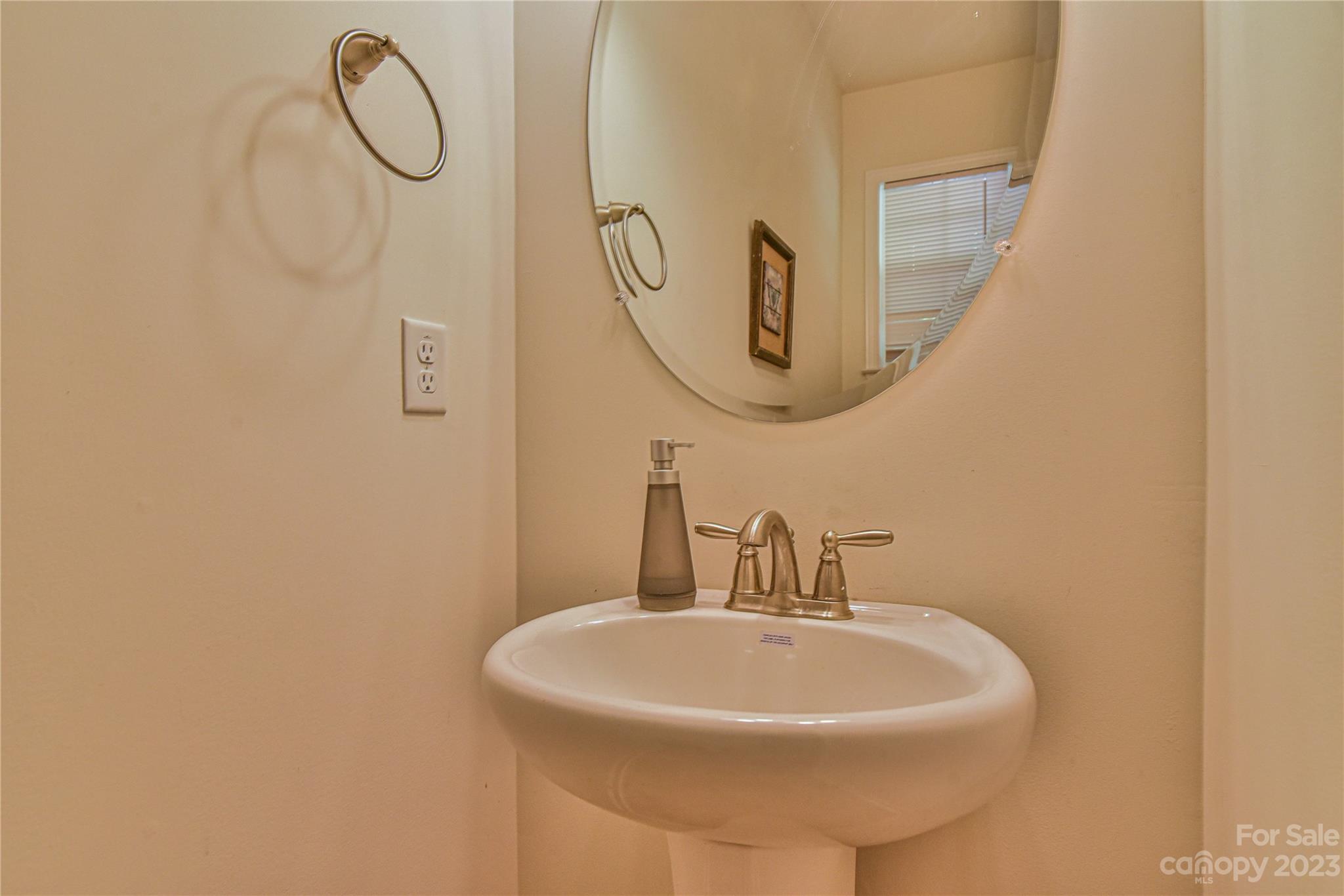 18 Yadkin Road Fletcher, NC 28732 - Photo 13 of 25 a bathroom with a sink a mirror and a shower