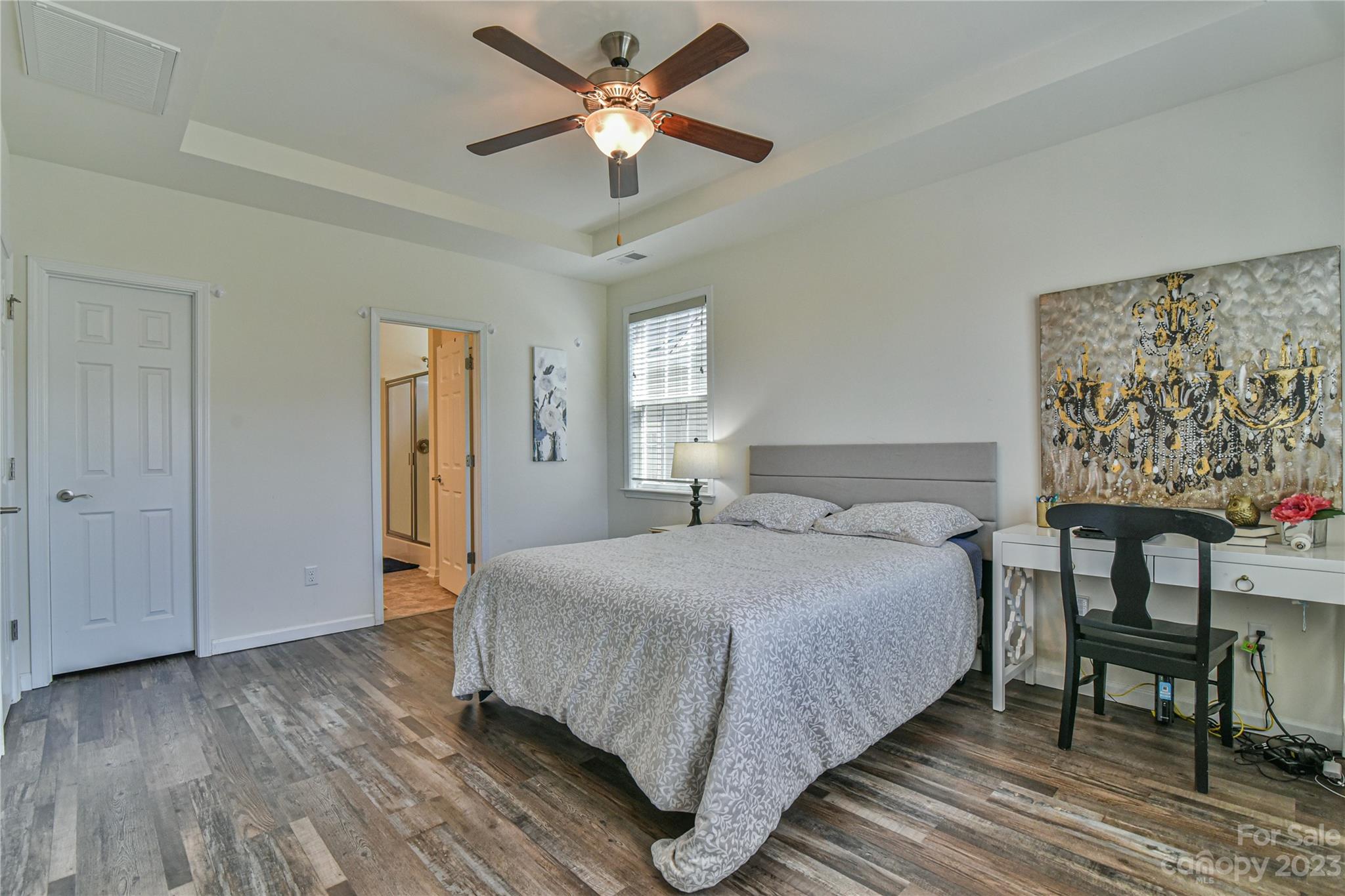 18 Yadkin Road Fletcher, NC 28732 - Photo 14 of 25 a bedroom with a bed and a table in it