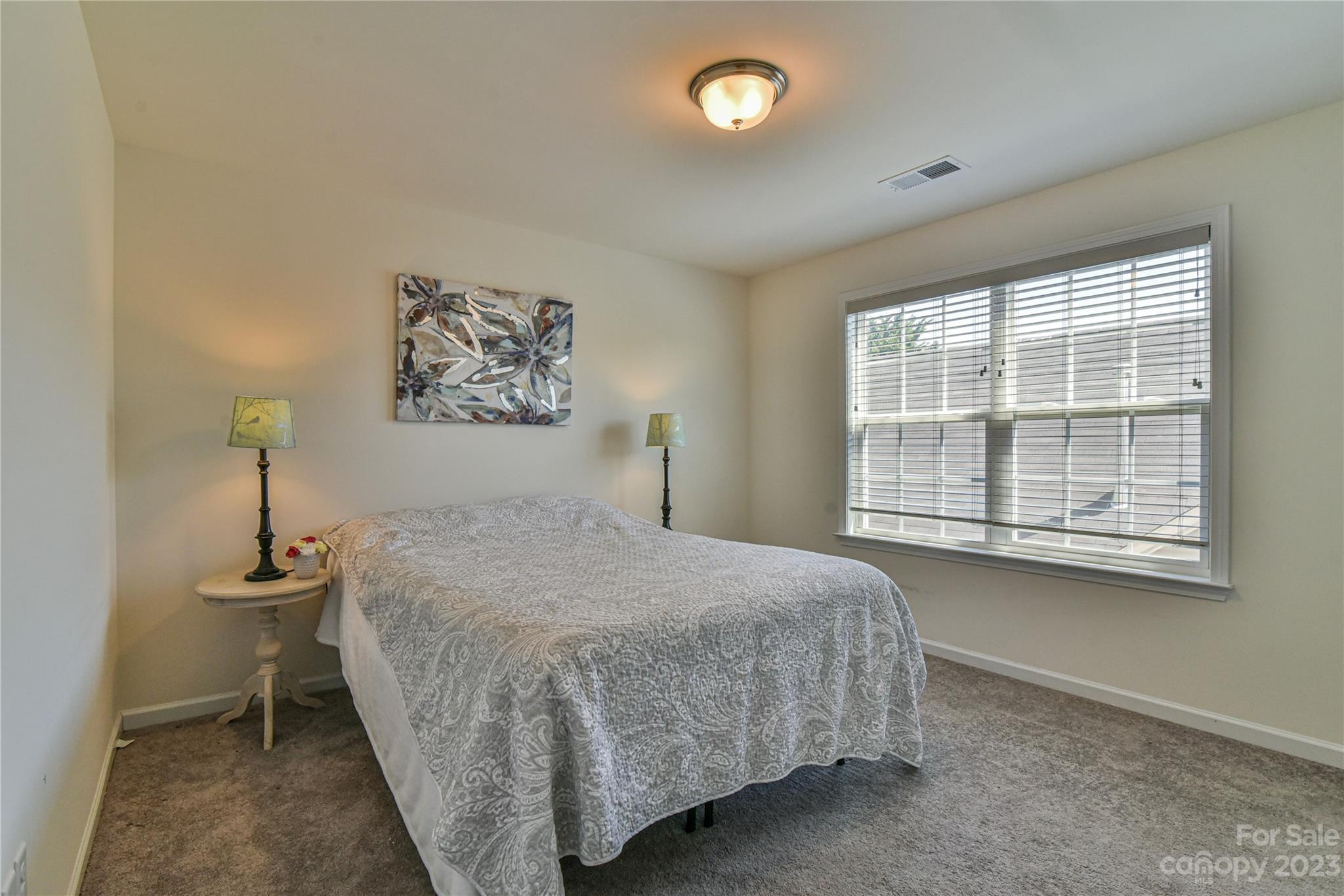 18 Yadkin Road Fletcher, NC 28732 - Photo 18 of 25 a bed sitting in a bedroom next to a window