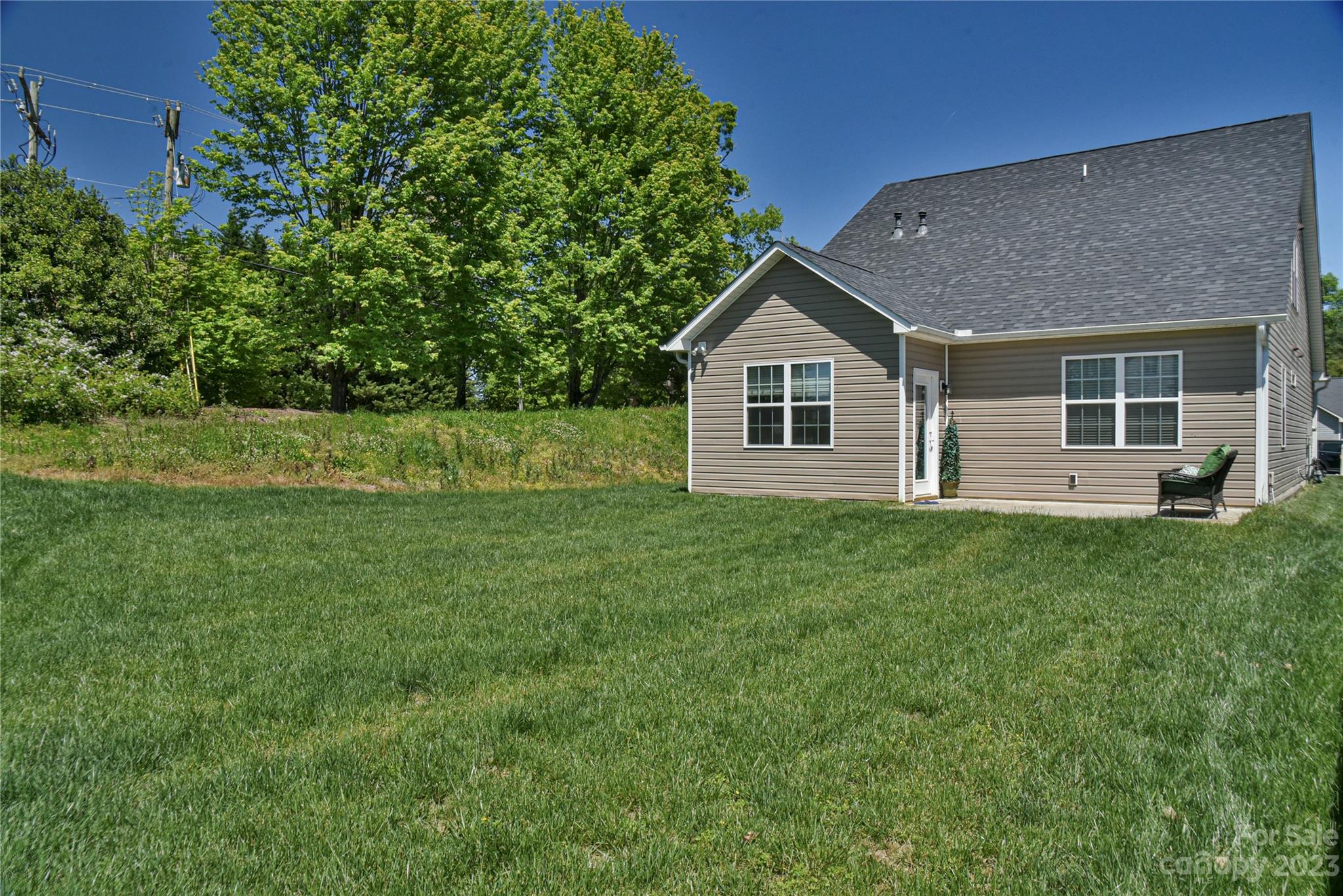 18 Yadkin Road Fletcher, NC 28732 - Photo 21 of 25 a view of a house with a backyard