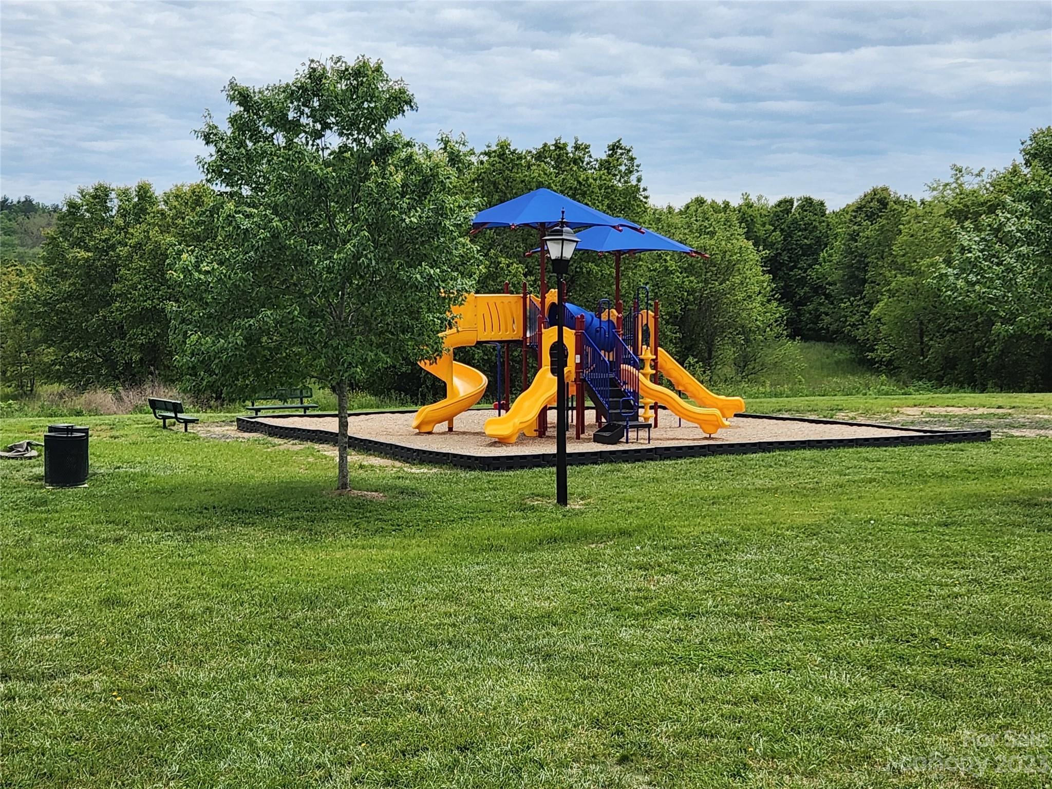 18 Yadkin Road Fletcher, NC 28732 - Photo 24 of 25 a view of a park with a slide