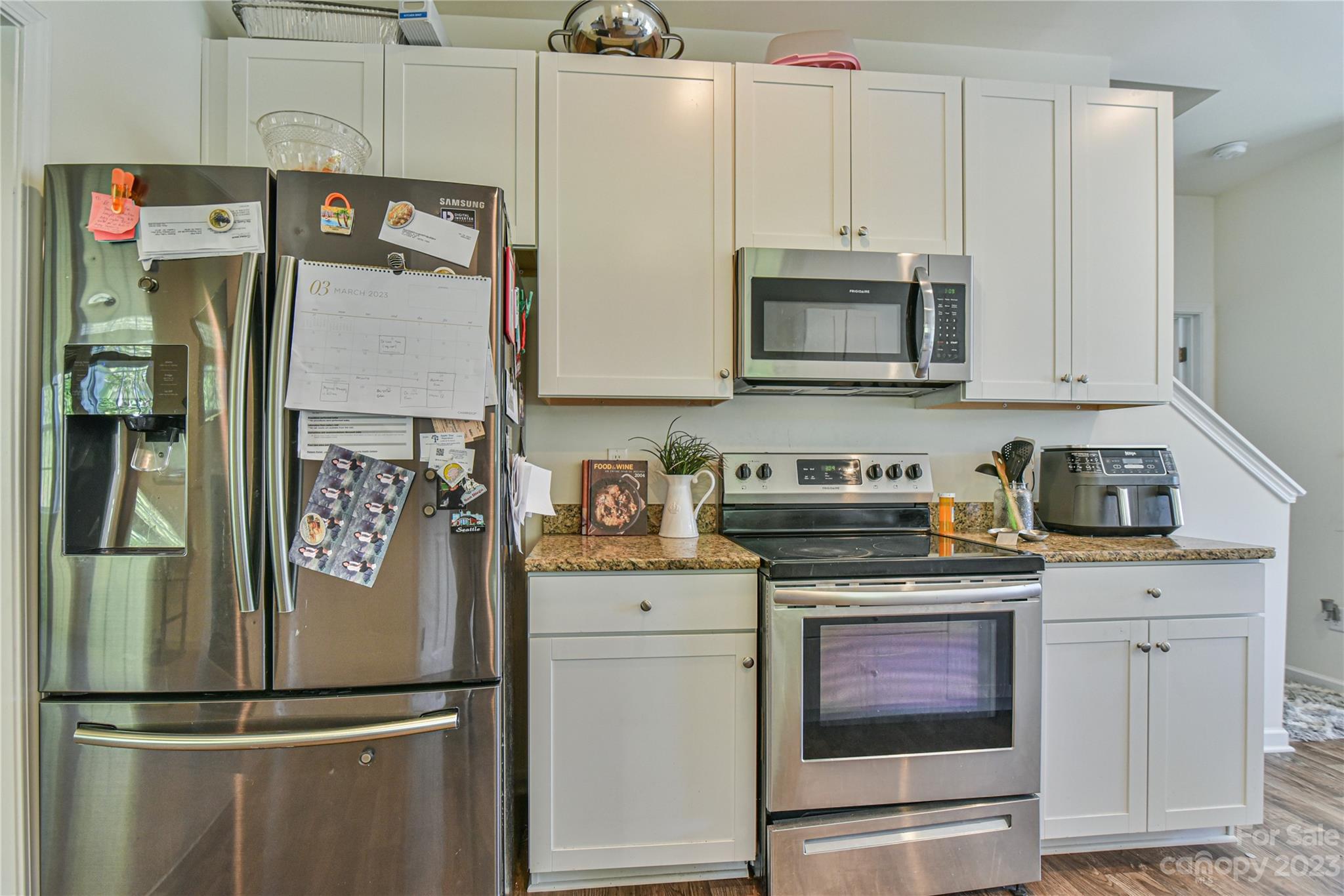 18 Yadkin Road Fletcher, NC 28732 - Photo 7 of 25 a kitchen with stainless steel appliances granite countertop a refrigerator and a stove