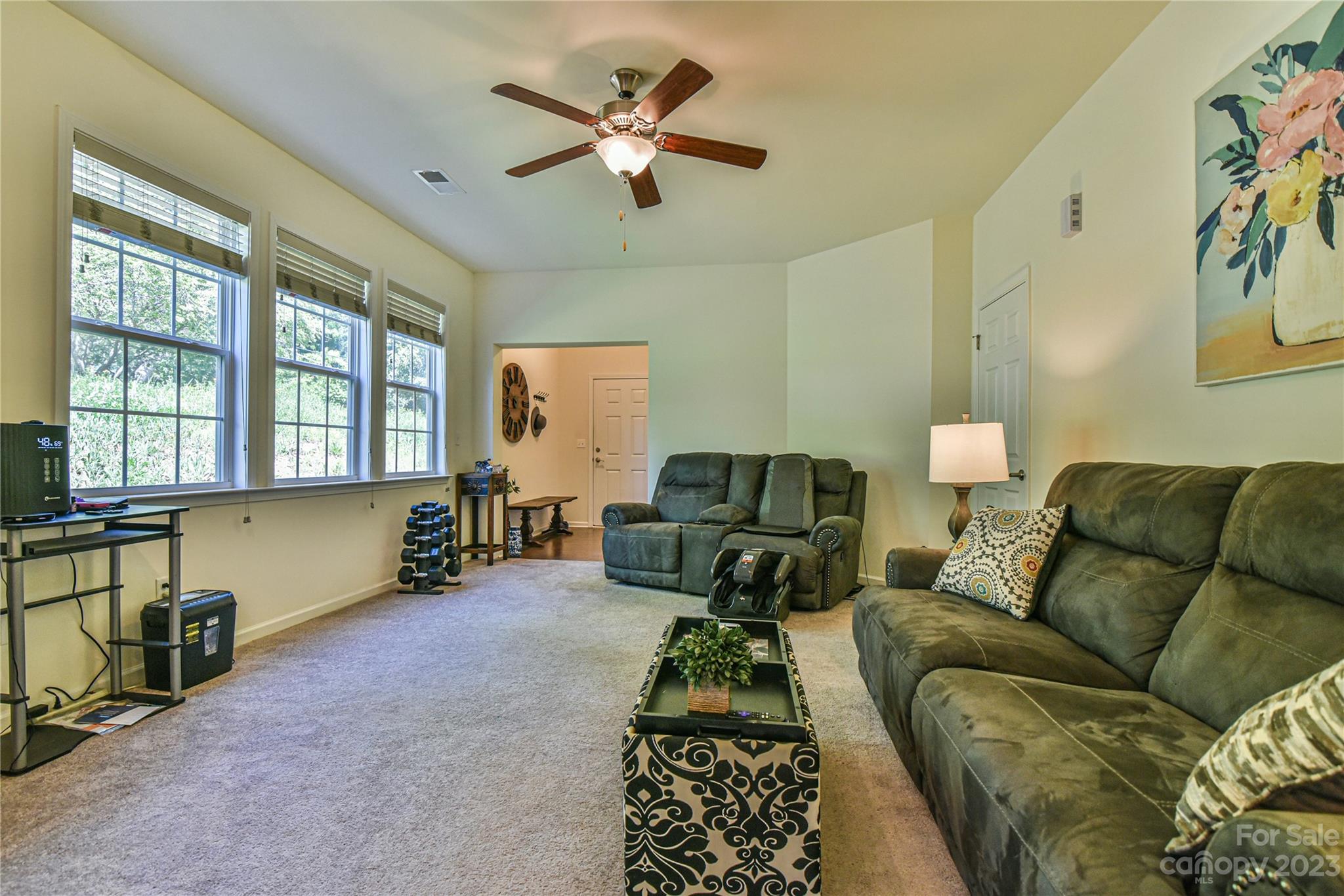 18 Yadkin Road Fletcher, NC 28732 - Photo 8 of 25 a living room with furniture gym equipment and a window