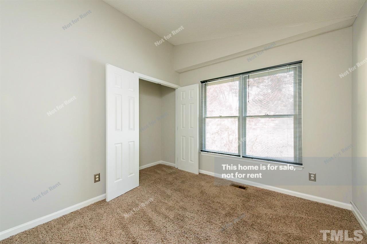 2412 Calvert Drive Raleigh, NC 27610 - Photo 14 of 19 an empty room with windows