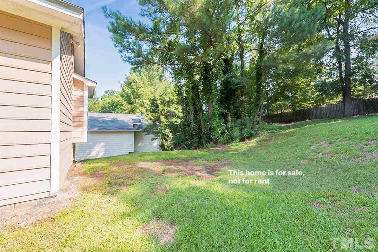 2412 Calvert Drive Raleigh, NC 27610 - Photo 18 of 19 a view of a back yard of the house