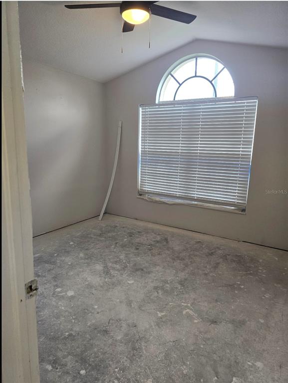 8640 Hawbuck Street Trinity, FL 34655 - Photo 16 of 33 an empty room with windows