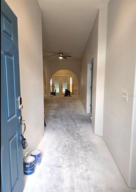8640 Hawbuck Street Trinity, FL 34655 - Photo 2 of 33 a view of a livingroom with furniture and an empty room