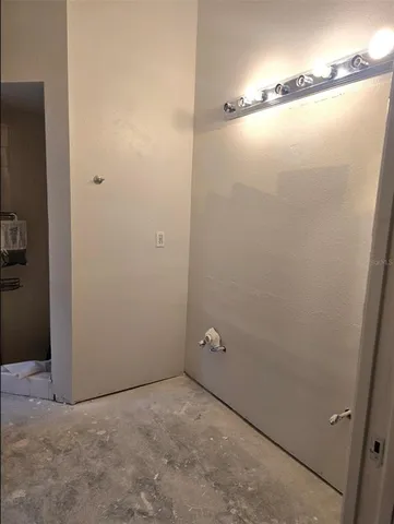 a room with wooden cabinets and a sink