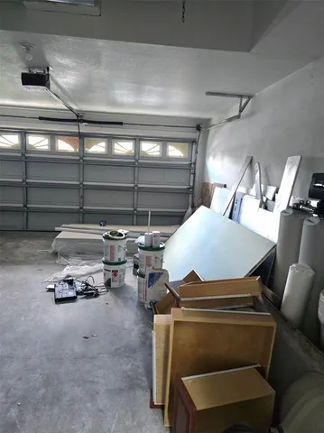 a view of a backyard with plants and a garden