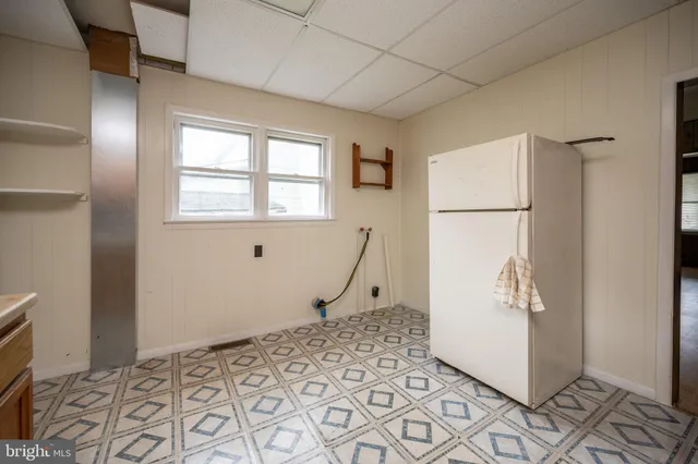 a spacious bathroom with a sink mirror and a bathtub
