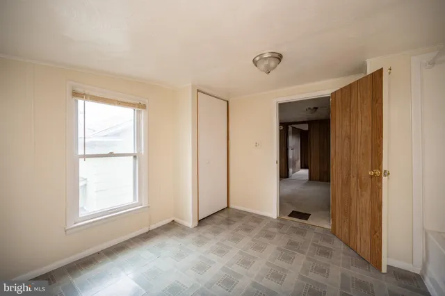 a view of a bathroom with a sink and a mirror