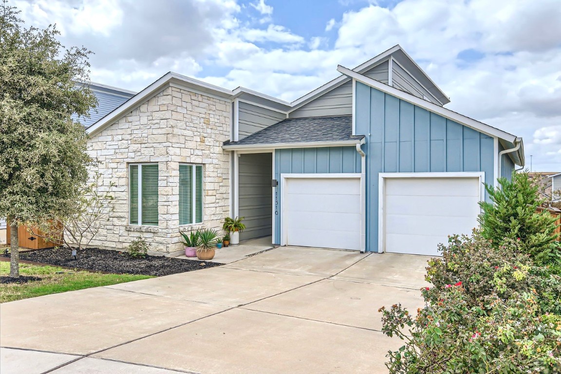 11516 Brindle Court Manor, TX 78653 - Photo 1 of 1 a front view of a house with yard and tress
