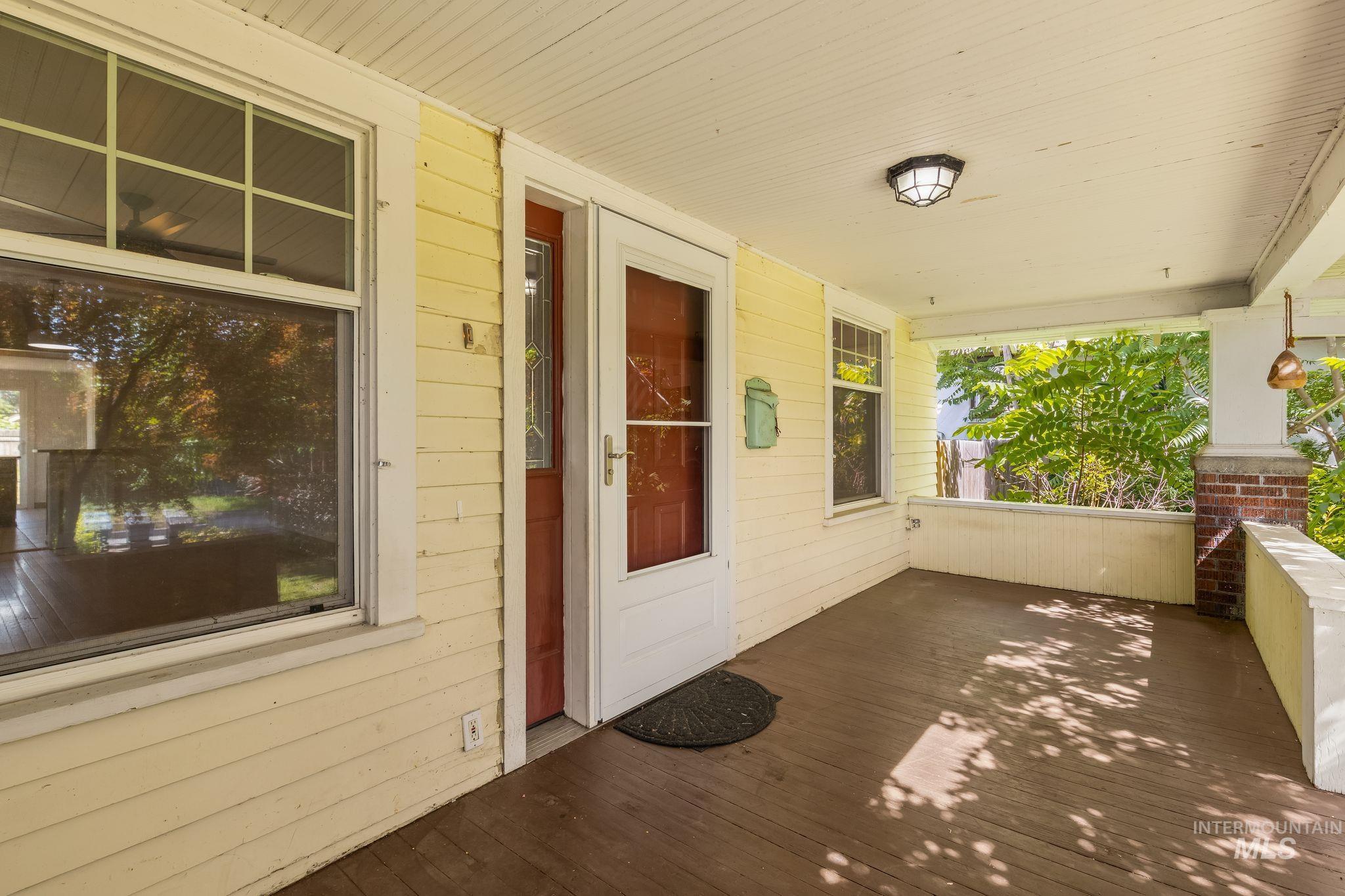 928 3rd Street Clarkston, WA 99403 - Photo 2 of 44 Covered front porch with wood flooring and light yellow siding