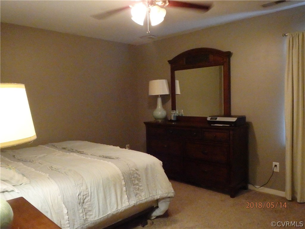5036 Alberta Road Chesterfield, VA 23832 - Photo 18 of 20 a bedroom with a bed and a mirror
