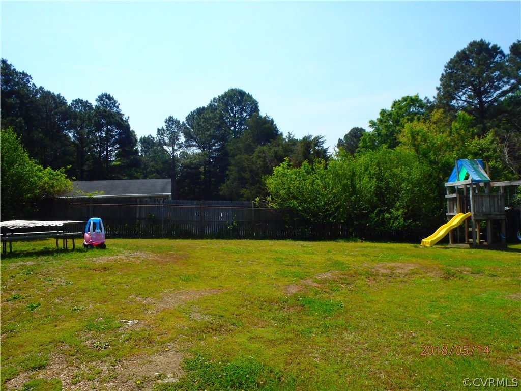 5036 Alberta Road Chesterfield, VA 23832 - Photo 5 of 20 a view of a swimming pool with a yard and a fire pit