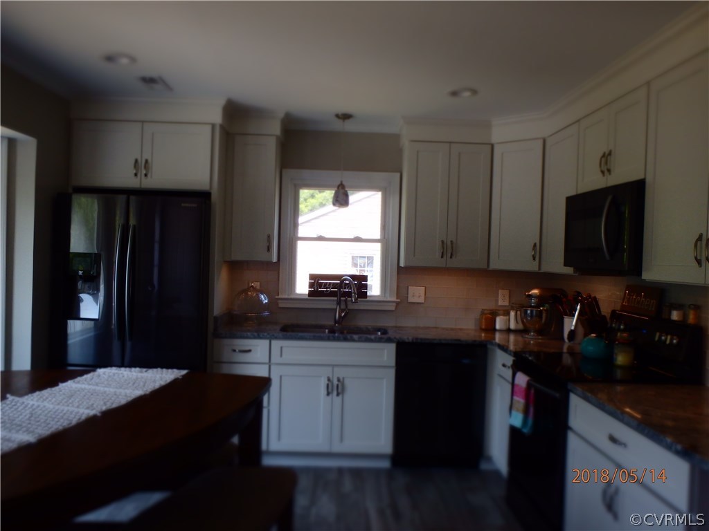 5036 Alberta Road Chesterfield, VA 23832 - Photo 8 of 20 a kitchen with a sink a window and stainless steel appliances