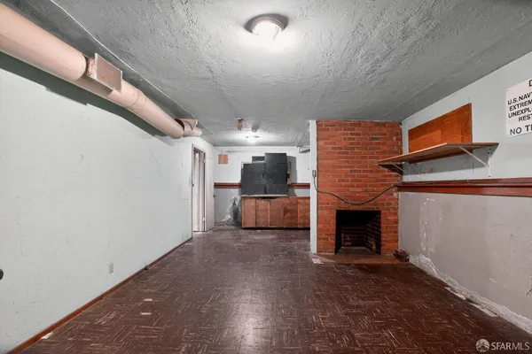 a view of living room with furniture and fireplace