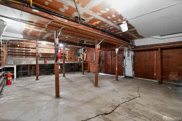 a view of empty room with wooden ceiling