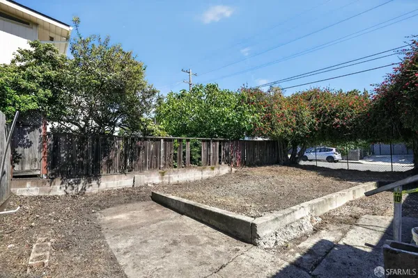 a view of a backyard with sitting area