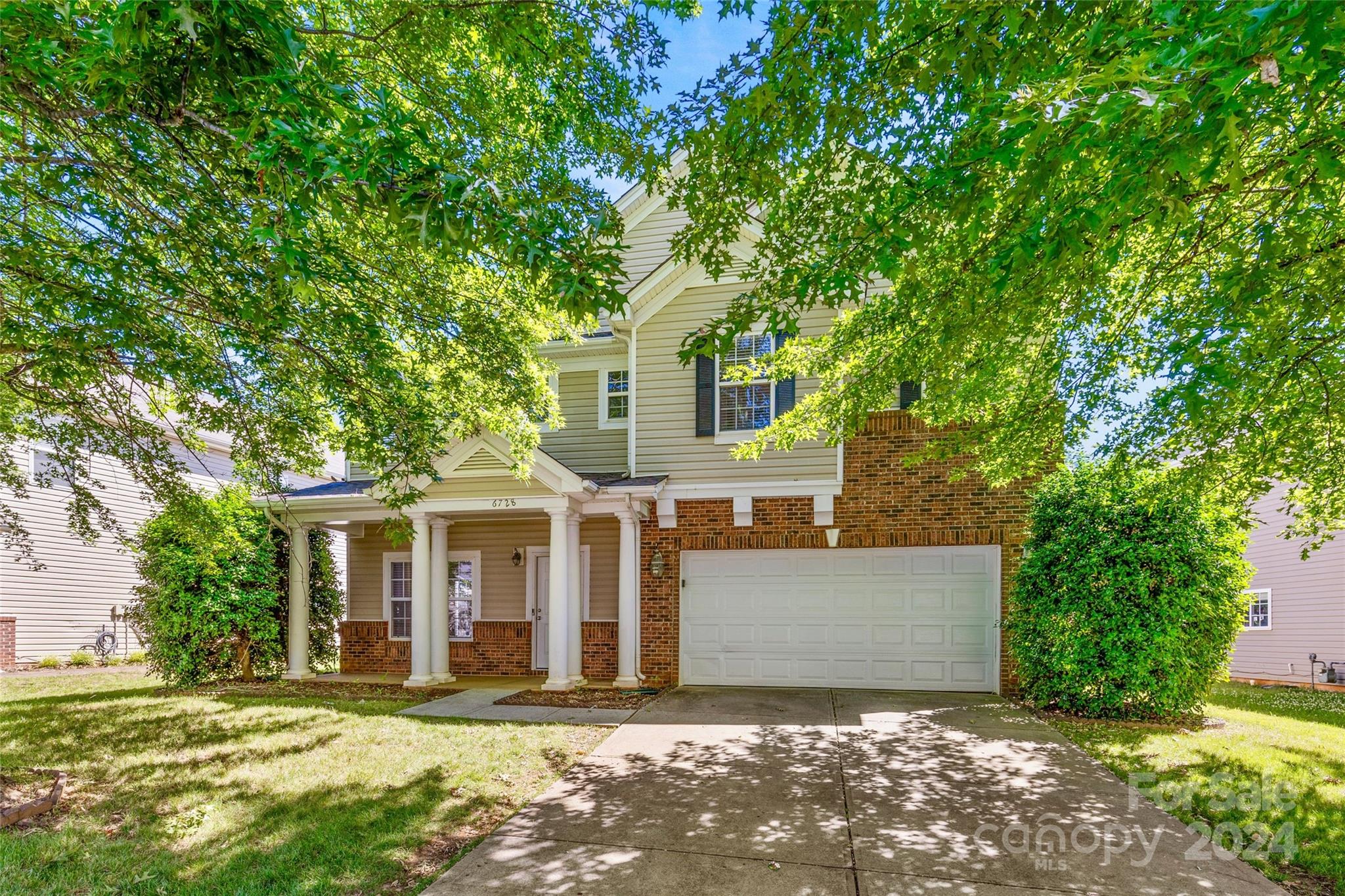 front view of a house with a yard