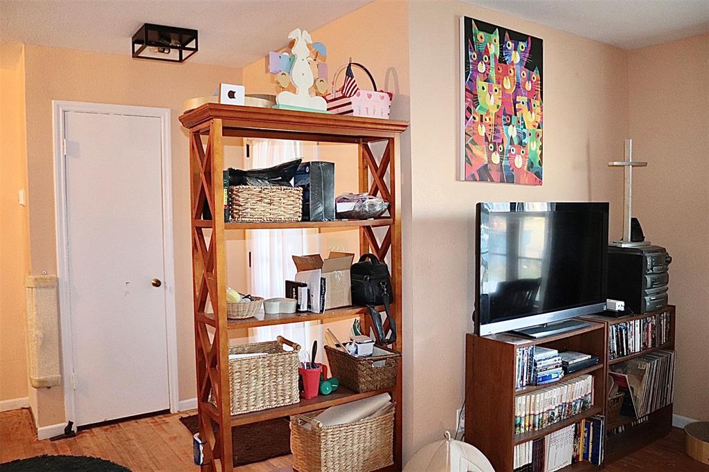 109 Novice Road Winters, TX 79567 - Photo 27 of 32 a bedroom with furniture and a flat screen tv