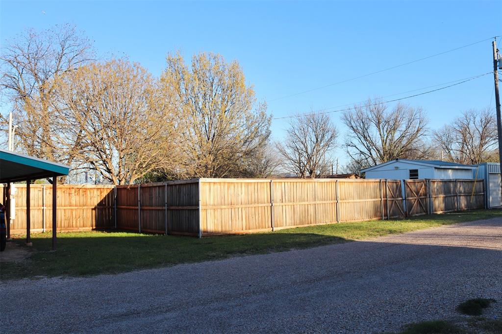 109 Novice Road Winters, TX 79567 - Photo 6 of 32 a view of backyard and tree