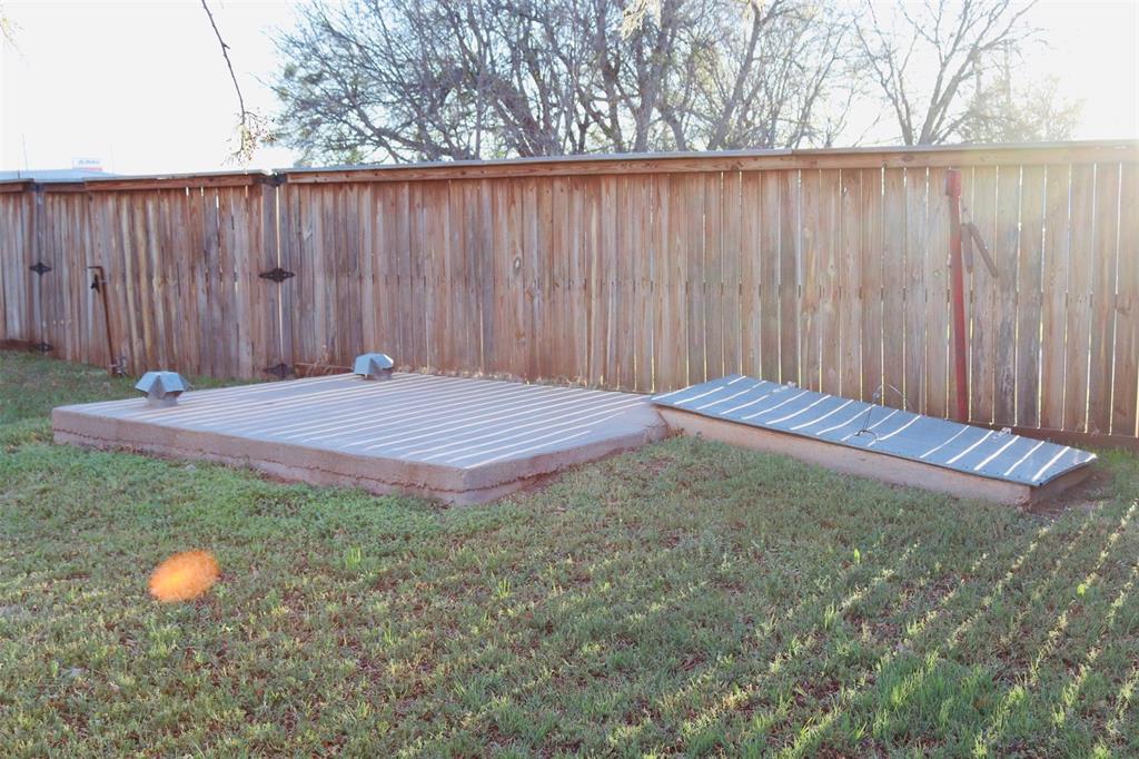 109 Novice Road Winters, TX 79567 - Photo 8 of 32 a view of outdoor space with wooden fence