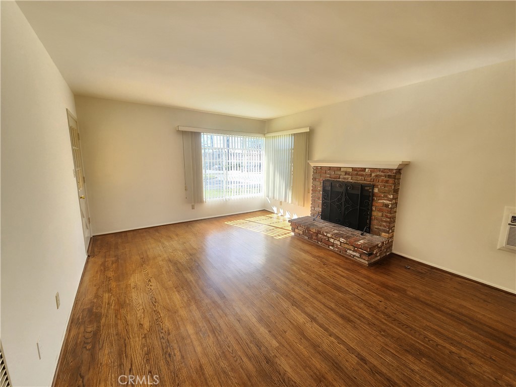 21 West Newman Avenue Arcadia, CA 91007 - Photo 11 of 29 a view of an empty room with wooden floor and a window