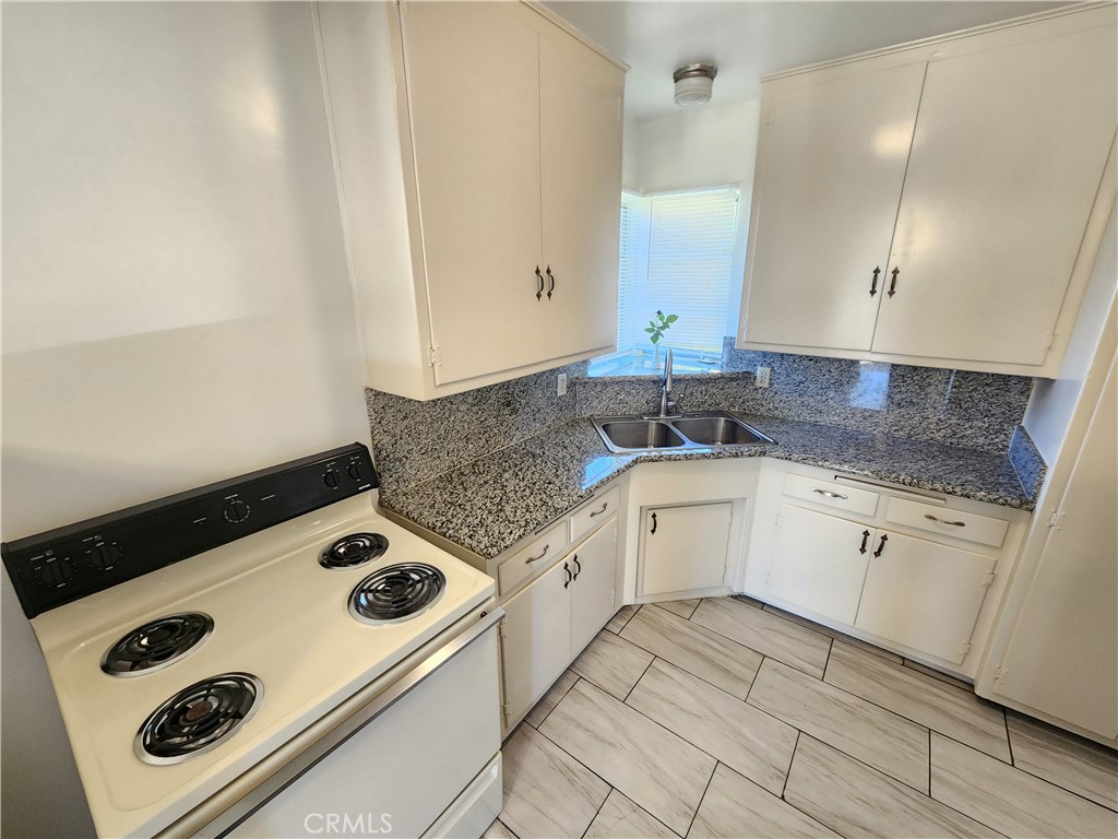 21 West Newman Avenue Arcadia, CA 91007 - Photo 14 of 29 a kitchen with a stove and a white cabinets