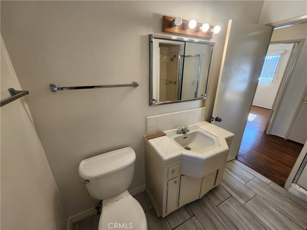 21 West Newman Avenue Arcadia, CA 91007 - Photo 18 of 29 a bathroom with a toilet sink and mirror