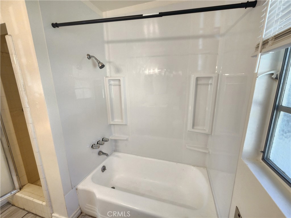 21 West Newman Avenue Arcadia, CA 91007 - Photo 19 of 29 a bathroom with a bathtub and a shower