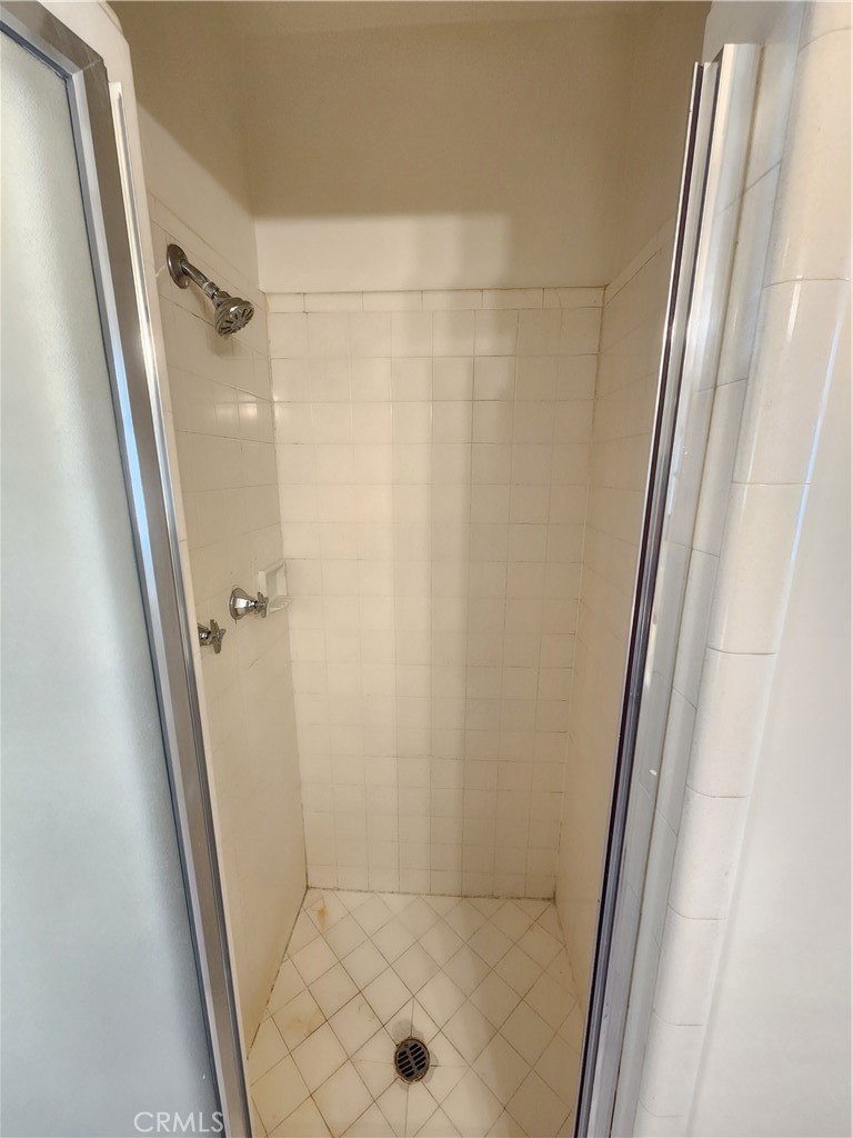 21 West Newman Avenue Arcadia, CA 91007 - Photo 20 of 29 a bathroom with a glass door shower and a sink