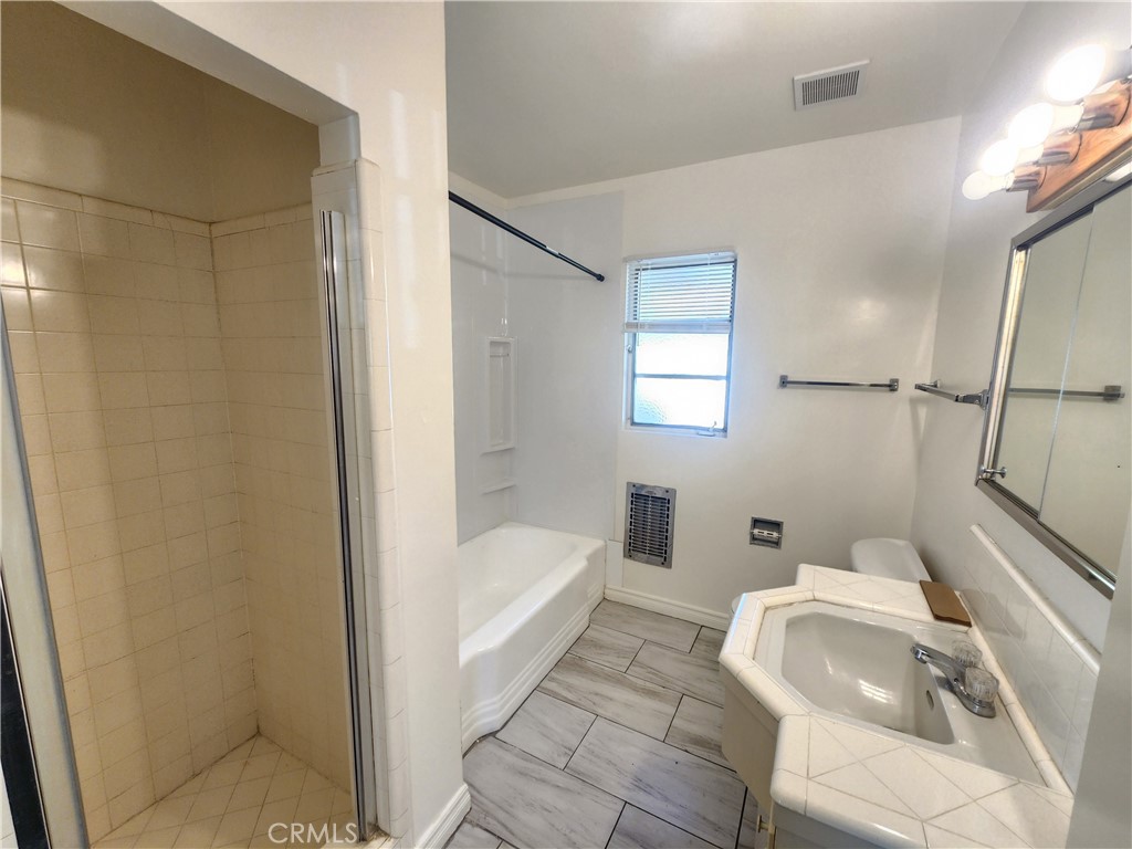 21 West Newman Avenue Arcadia, CA 91007 - Photo 21 of 29 a bathroom with a tub and toilet