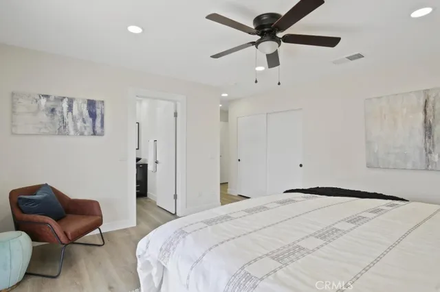 a bedroom with a bed and window