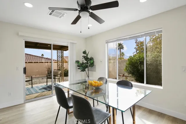a dining room with furniture and window